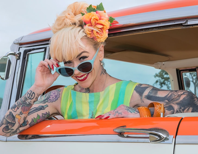 Model leaning from car window GreazeFest 