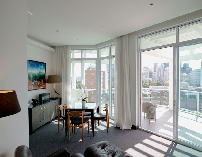 Hotel room with view, table & Chair The Point Brisbane Hotel