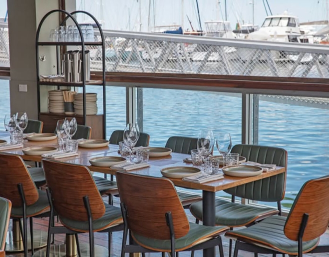Tables overlooking water at Wang Chung 