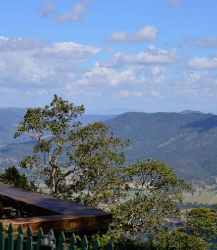 patrons sitting at table with views at The Polish Place in Mt Tamborine Qld