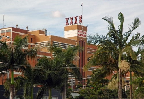 XXXX Brewery Milton XXXX Brewery red brick building, sign and palm trees in Milton