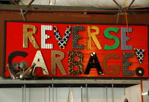 Reverse Garbage sign made out of recycled materials