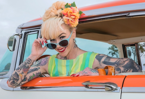 Model leaning from car window GreazeFest 