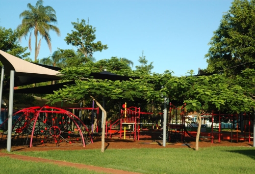 Playground equipment and vegetation surrounding Gregory Park in Milton