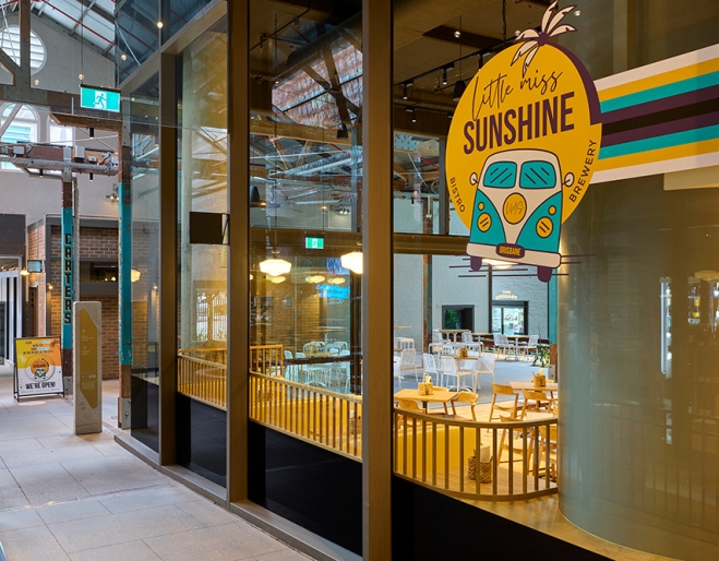 Front window with signage at Little Miss Sunshine Brisbane CBD