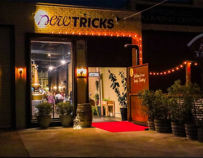 Exterior entry to New Tricks Albion by night