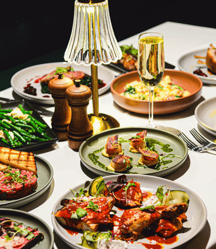 Food on plates at Hepburn's Steakhouse Wynnum