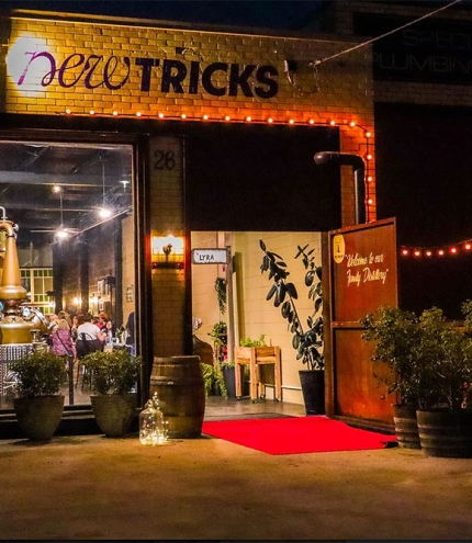 New Tricks Albion Exterior entry to New Tricks Albion by night