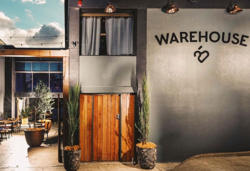 Exterior lit up facade of Warehouse 25, Milton