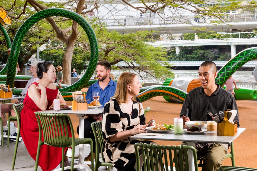 People sitting at tables outside GOMA Bistro